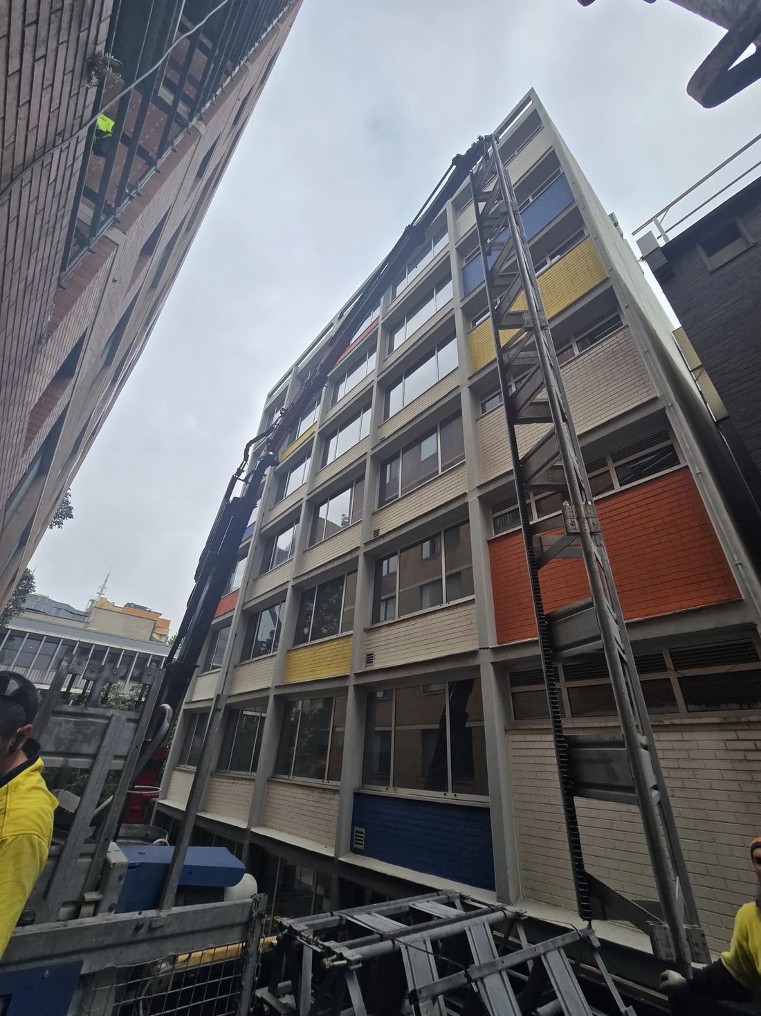 Crane lifting with a dogman guiding the load on a Sydney site
