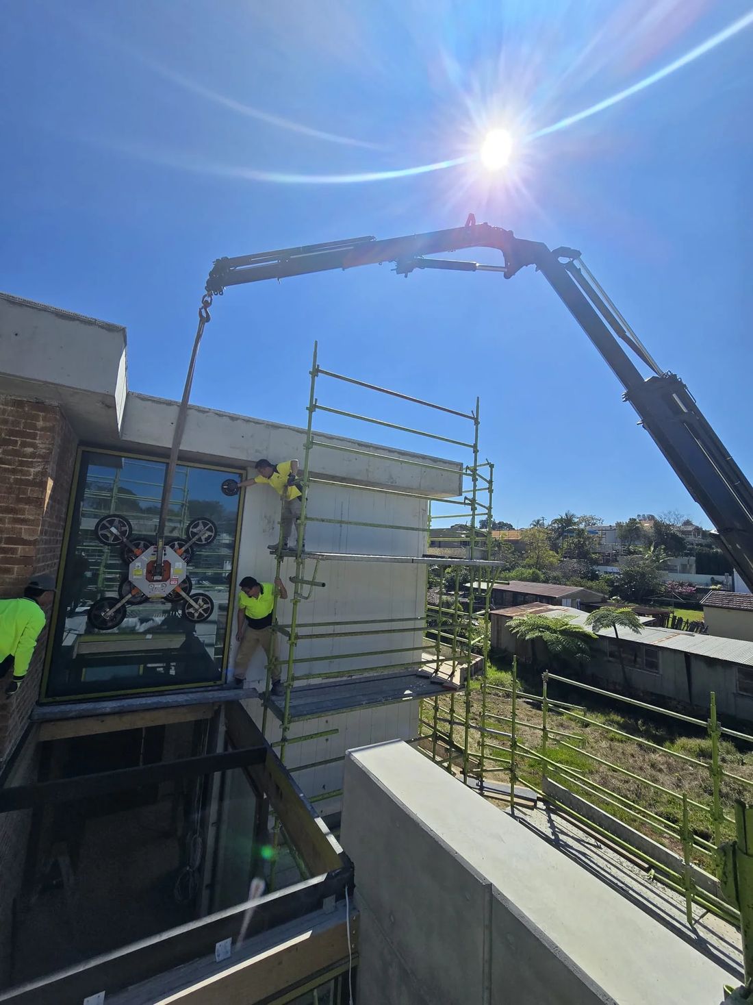 Crane working over a school building site
